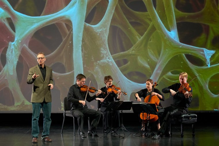 Robert Davies (standing) and the quartet during a performance of "The Crossroads Project." Musicians include (left to right) Robert Waters, Rebecca McFaul, Anne Francis Bayless and Bradley Ottesen. Andrew McCallister /Courtesy of The Crossroads Project 